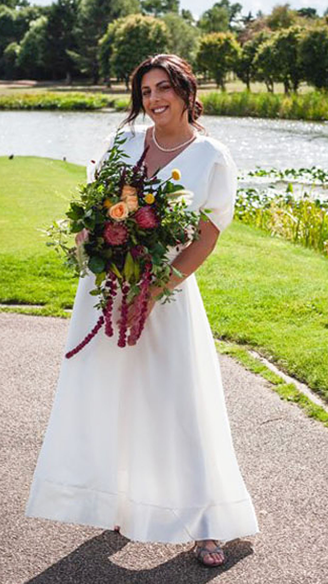 Bespoke silk crepe satin wedding dress for a summer bride